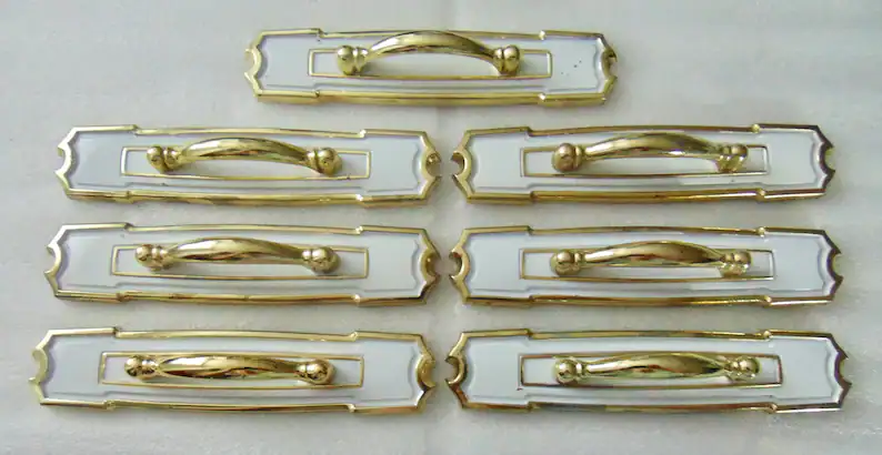 white and gold vintage cabinet pulls with large back plate