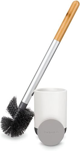 Eco-friendly cleaning brush with wooden handle and holder for sustainable home cleaning.