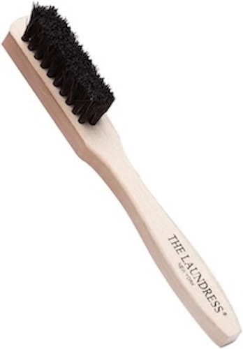 Wooden cleaning brush with black bristles for laundry and household cleaning.