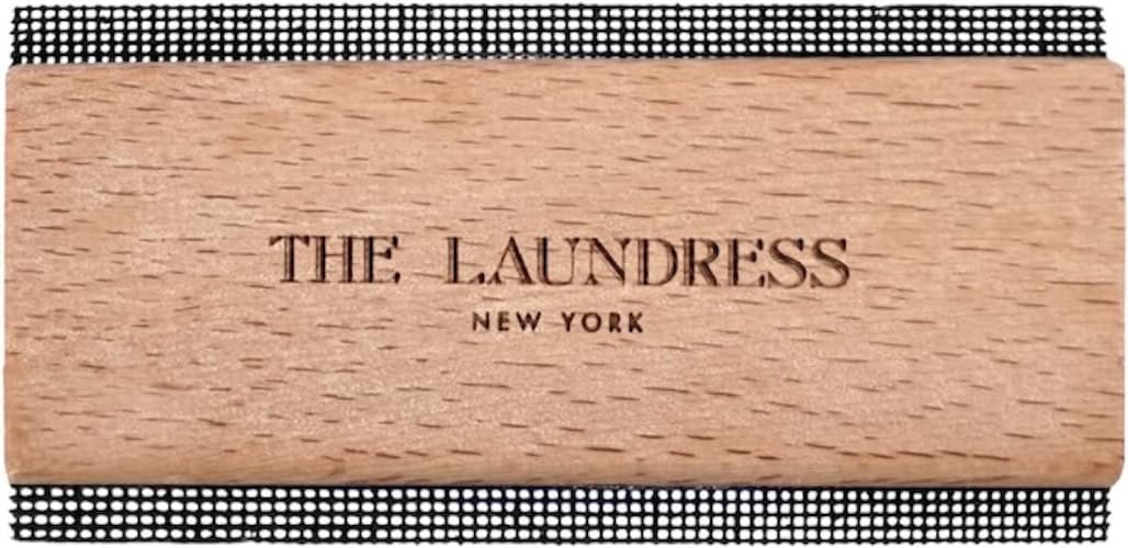 Wooden laundry sign with "The Laundress" branding for home decor.