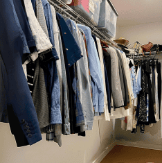 Before photo of a master closet with wire shelving, showcasing a cramped and cluttered space in need of a DIY closet transformation.
