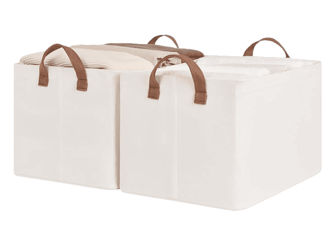 an image of a set of 2 ivory fabric Closet Baskets with brown faux leather handles in size 16.5"L x 12"W x 10.25"H