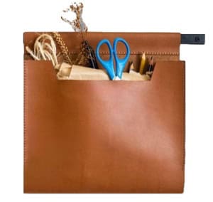 A brown leather organizer pouch