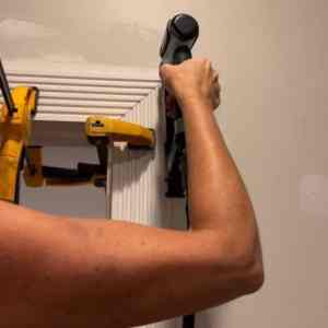 attaching door casing with clamps and a nail gun