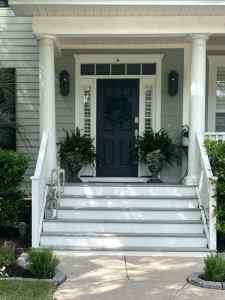Freshly painted exterior stairs with smooth wood and crisp white and gray finish after wood stair repair