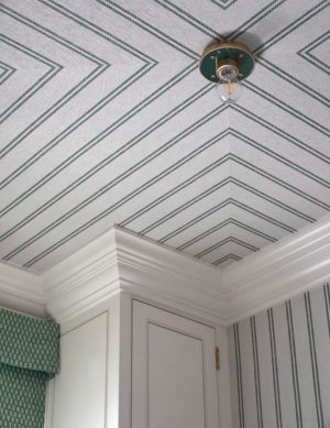 an image of striped textured wallpaper with green and white ticking stripes placed on the ceiling.