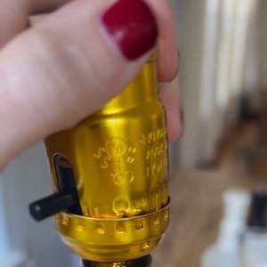 sliding the socket shell over the wired base and snap it into place