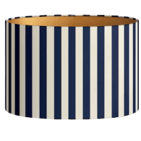 A cylindrical lampshade featuring a navy blue and cream vertical striped design.