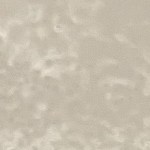 Spray-painted surface with patchy, uneven color distribution due to inconsistent spraying technique