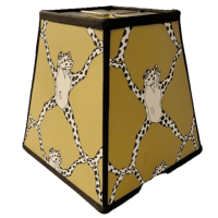 A colorful decorative stool featuring a quirky design of cartoon frogs with black spots wearing white shirts, set against a yellow background.
