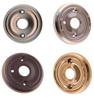 Four different styles of door handle escutcheons in metallic finishes, including bronze, brass, and chrome.