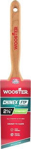 A Wooster Chinex paintbrush with a wooden handle and a 2.5-inch wide synthetic bristle head, designed for smooth application of paint and easy cleaning.