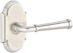 A polished metal door handle with a traditional design.