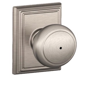 Brushed nickel door knob with rectangular backplate, showcasing a classic design.