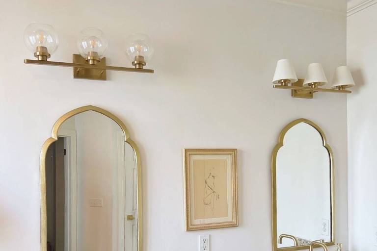 Side-by-side before and after of DIY bathroom lighting refresh with linen shades.