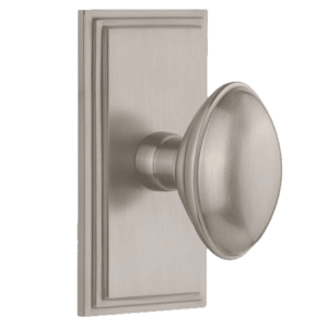 Ornate Grandeur nickel interior door knob on a decorative backplate.