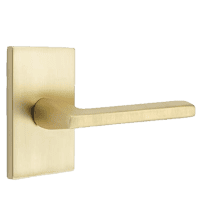 Emtek modern interior door lever in a satin brass finish.