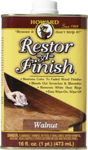 A can of Howard Restor-A-Finish in Walnut color, designed to restore and enhance wood finishes, featuring a label with instructions and product details.