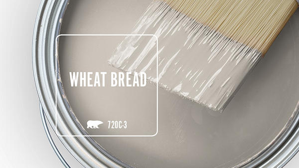 Close-up of a paint can with a brush resting on the surface, labeled 'Wheat Bread'.