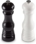 Pepper mills for dining table, black and white, perfect for seasoning meals.