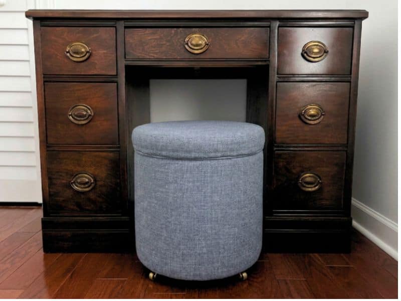 Refinished wood desk with gray ottoman