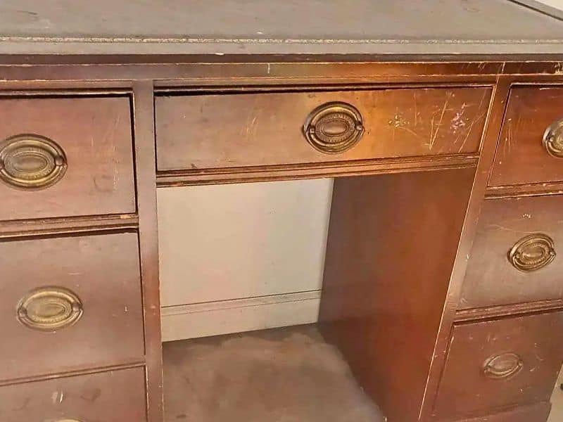Scratches on wood desk before refinishing